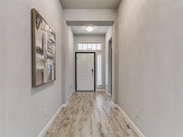 12929 NW 4th St, Yukon, OK 73099 - doorway to outside with light wood-style flooring and baseboards