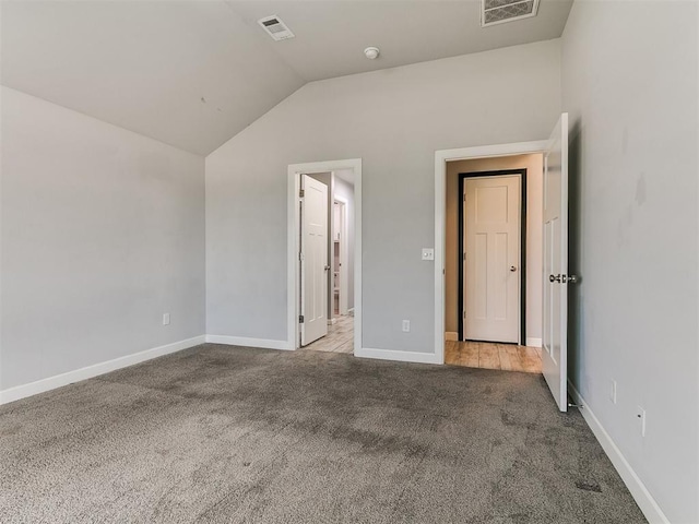 12929 NW 4th St, Yukon, OK 73099 - unfurnished bedroom with carpet floors and vaulted ceiling
