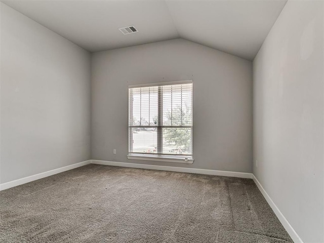 12929 NW 4th St, Yukon, OK 73099 - carpeted empty room with vaulted ceiling and baseboards