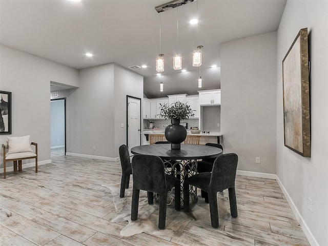 12929 NW 4th St, Yukon, OK 73099 - dining area with light wood finished floors and recessed lighting