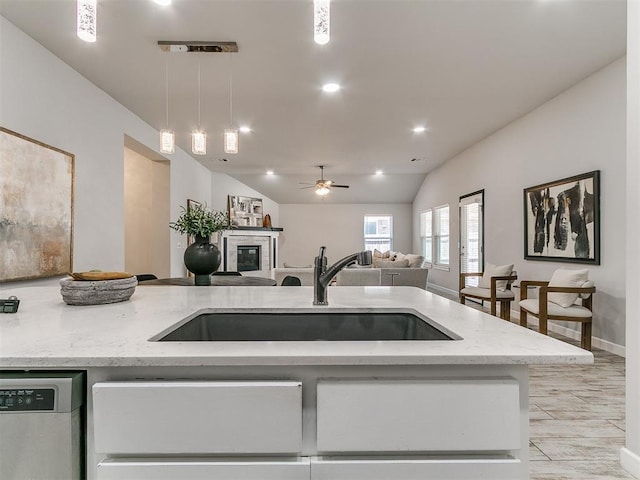 12929 NW 4th St, Yukon, OK 73099 - kitchen with dishwasher, open floor plan, light stone counters, decorative light fixtures, and ceiling fan