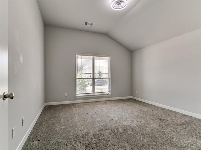 12929 NW 4th St, Yukon, OK 73099 - unfurnished room featuring carpet floors and vaulted ceiling