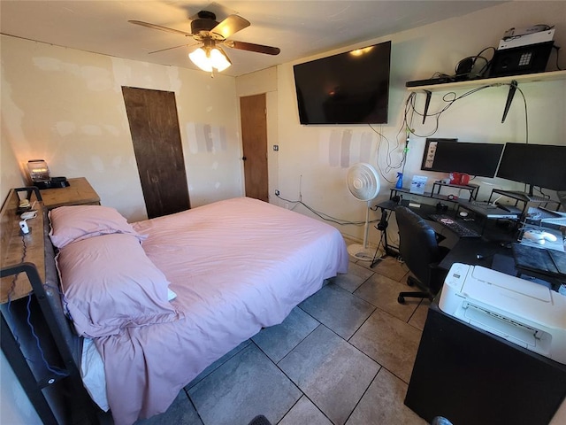 bedroom featuring tile patterned flooring and a ceiling fan