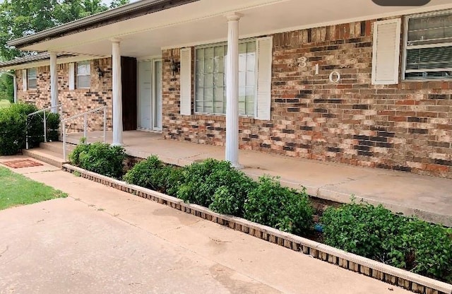 310 Walter Way, Anadarko, OK 73005 - entrance to property with covered porch and brick siding