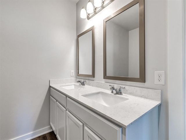 bathroom featuring double vanity and a sink