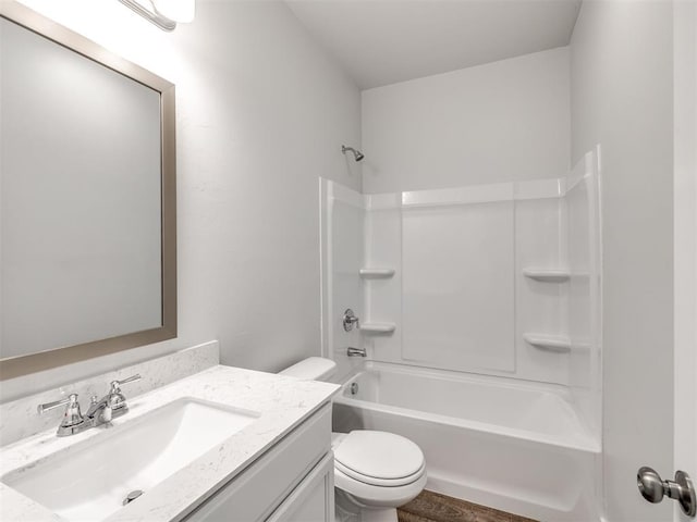 full bath with vanity, shower / bathing tub combination, and toilet