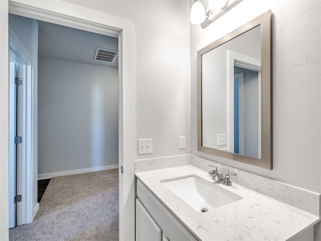bathroom featuring visible vents and vanity