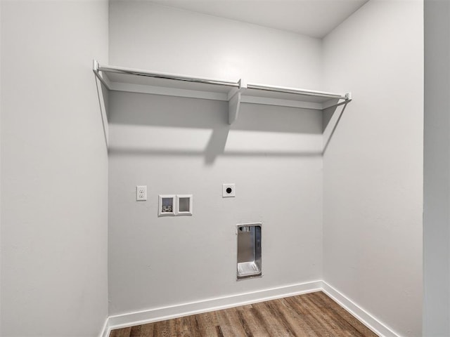 clothes washing area featuring washer hookup, laundry area, baseboards, electric dryer hookup, and wood finished floors
