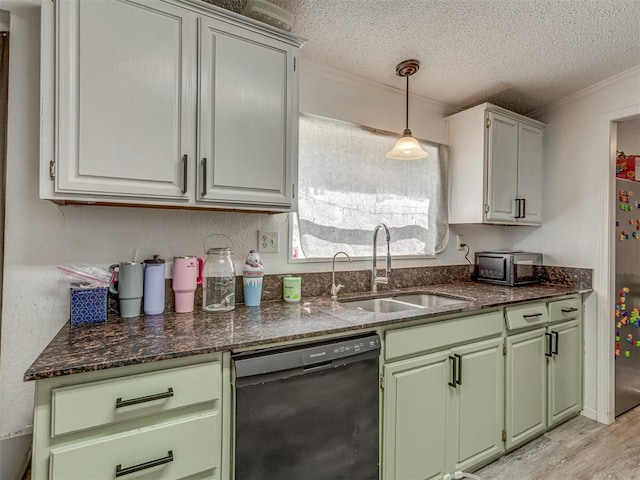 kitchen featuring a textured ceiling, crown molding, dishwasher, a sink, and green cabinetry