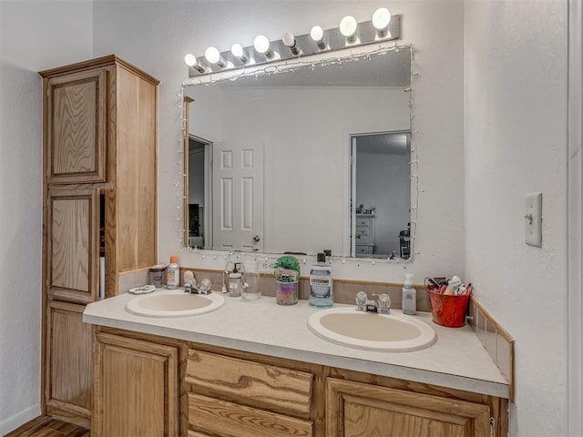 full bath with double vanity and a sink