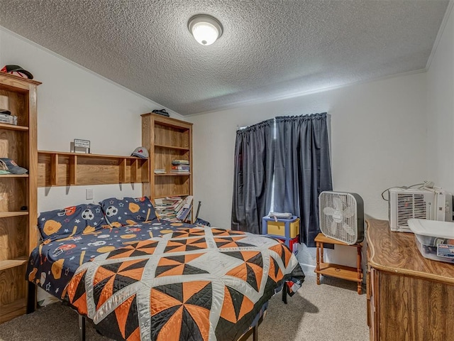 bedroom featuring carpet floors and a textured ceiling
