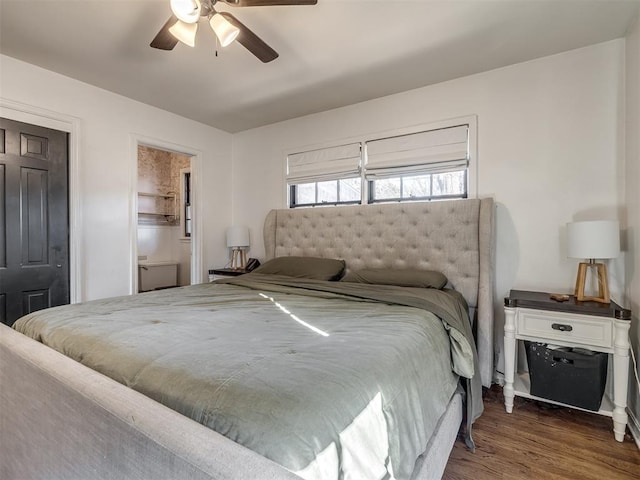 bedroom with dark wood-style flooring and ceiling fan