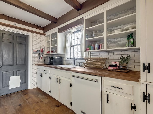 kitchen with a sink, wood counters, backsplash, and dishwasher