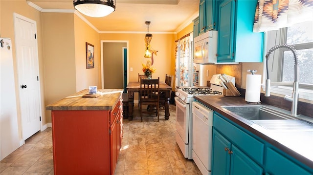 kitchen with crown molding, a sink, white appliances, pendant lighting, and butcher block counters