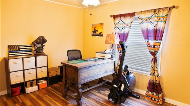 office area featuring baseboards, ornamental molding, and wood finished floors