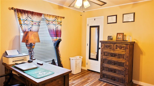 office with crown molding, ceiling fan, baseboards, and wood finished floors