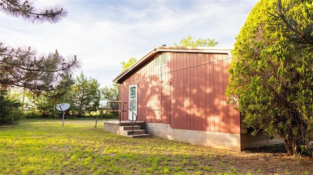 view of property exterior with a lawn