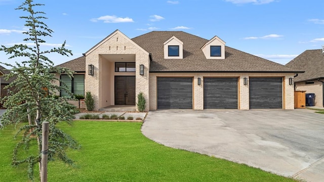 view of front of property with driveway, brick siding, a front lawn, a garage, and a shingled roof