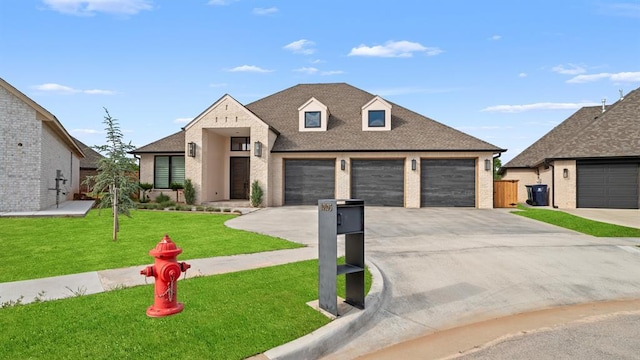 view of front of home featuring brick siding, concrete driveway, a front yard, and a shingled roof