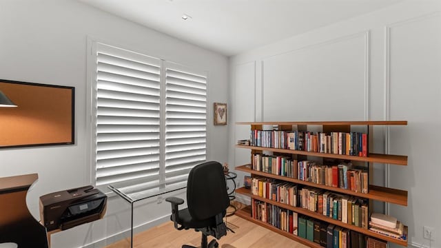home office with wood finished floors