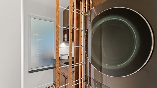 detailed view of stacked washer and clothes dryer