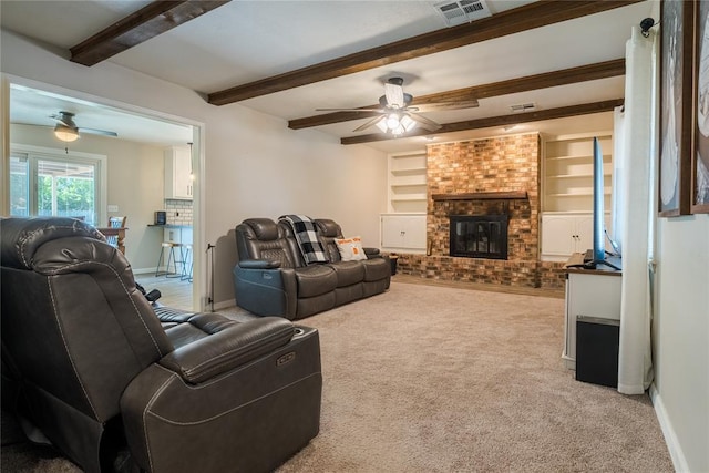 carpeted living room featuring visible vents, baseboards, ceiling fan, and beamed ceiling