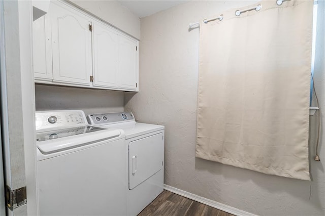 washroom featuring baseboards, dark wood-style flooring, cabinet space, and washer and dryer
