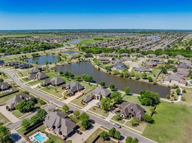 birds eye view of property featuring a residential view and a water view
