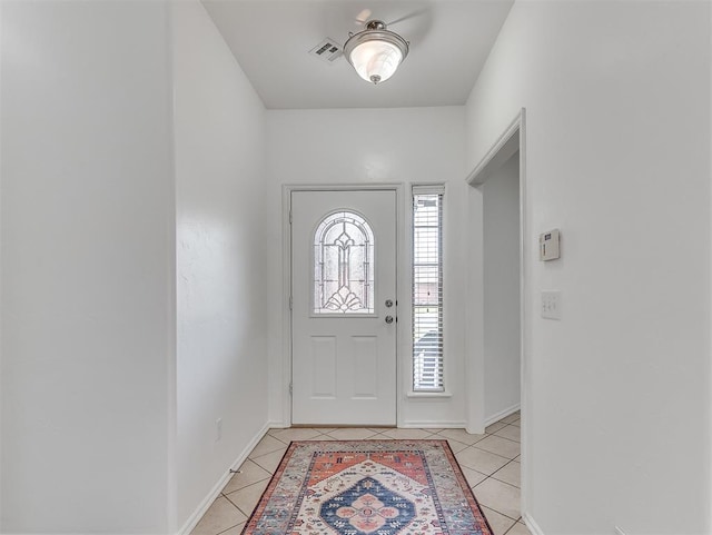 entrance foyer with light tile patterned flooring, baseboards, and visible vents
