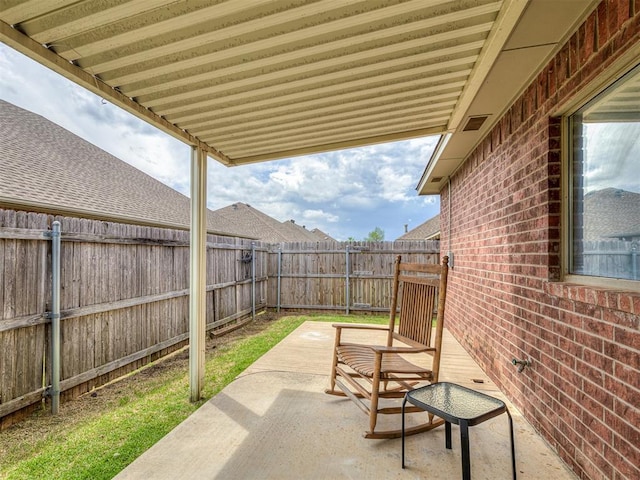 view of patio with a fenced backyard