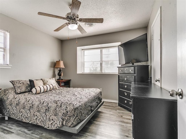 5416 S Independence Ave, Oklahoma City, OK 73119 - bedroom featuring multiple windows, wood finished floors, and visible vents