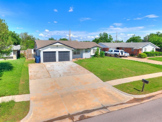 5416 S Independence Ave, Oklahoma City, OK 73119 - ranch-style home with fence, an attached garage, concrete driveway, and a front lawn