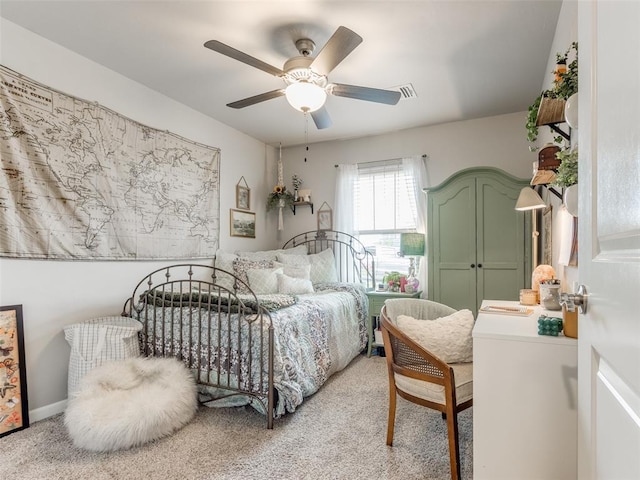 bedroom with light carpet and ceiling fan