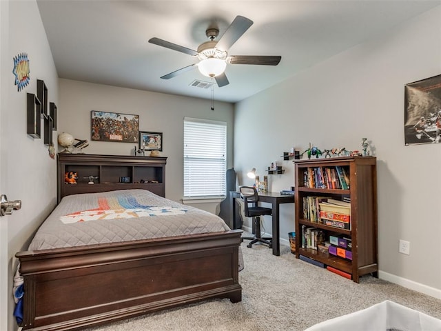 carpeted bedroom with baseboards and a ceiling fan