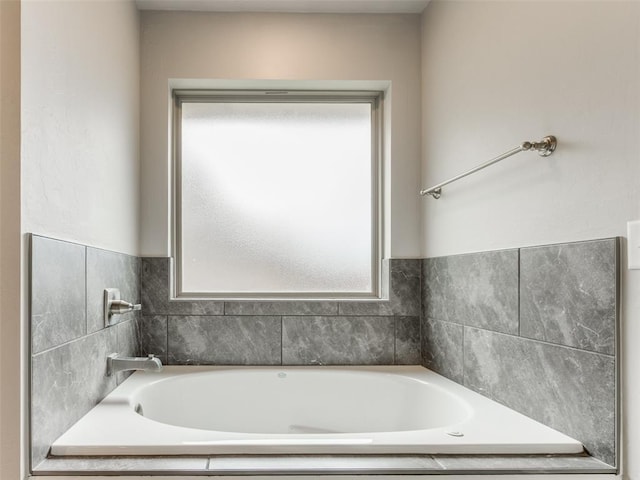 bathroom with a garden tub