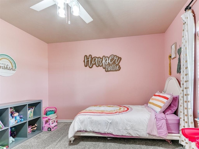 bedroom with ceiling fan, carpet floors, and baseboards