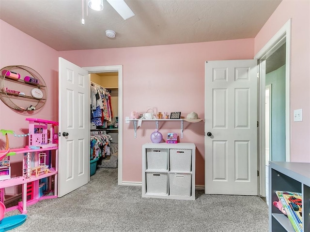 game room featuring baseboards and carpet floors