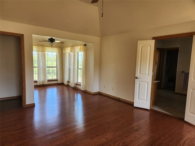 spare room with a ceiling fan, wood finished floors, baseboards, and lofted ceiling