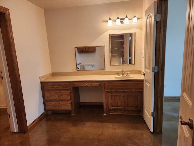 bathroom featuring vanity, baseboards, and a shower