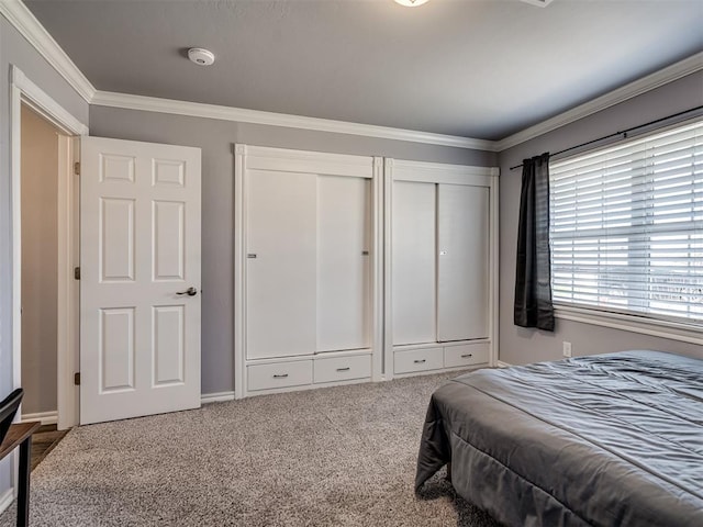 2013 N Draper Ave, Choctaw, OK 73020 - carpeted bedroom featuring multiple closets and ornamental molding