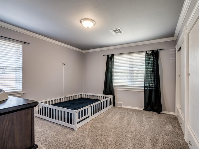 2013 N Draper Ave, Choctaw, OK 73020 - carpeted bedroom with crown molding, baseboards, and visible vents
