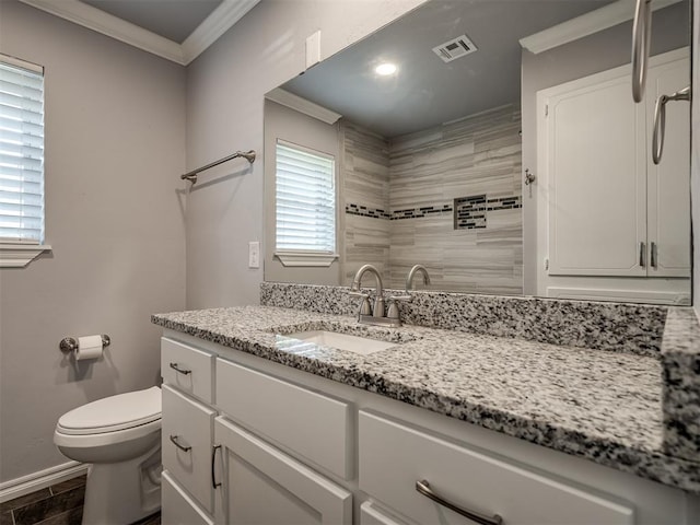 2013 N Draper Ave, Choctaw, OK 73020 - bathroom featuring visible vents, crown molding, vanity, baseboards, and toilet