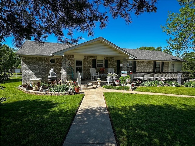16296 N County Road 3264th Rd, Pauls Valley, OK 73075 - view of front of property featuring a porch, brick siding, roof with shingles, and a front lawn