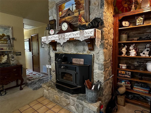 16296 N County Road 3264th Rd, Pauls Valley, OK 73075 - carpeted living room featuring tile patterned flooring, a wood stove, and visible vents