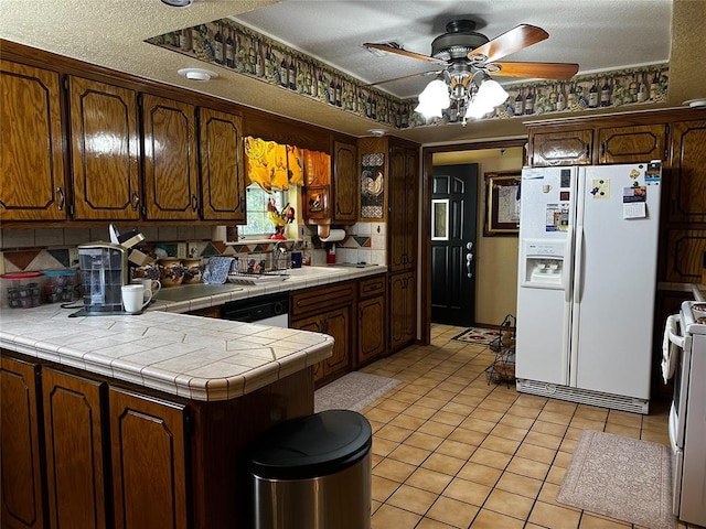 16296 N County Road 3264th Rd, Pauls Valley, OK 73075 - kitchen featuring white appliances, a ceiling fan, a peninsula, decorative backsplash, and light tile patterned floors