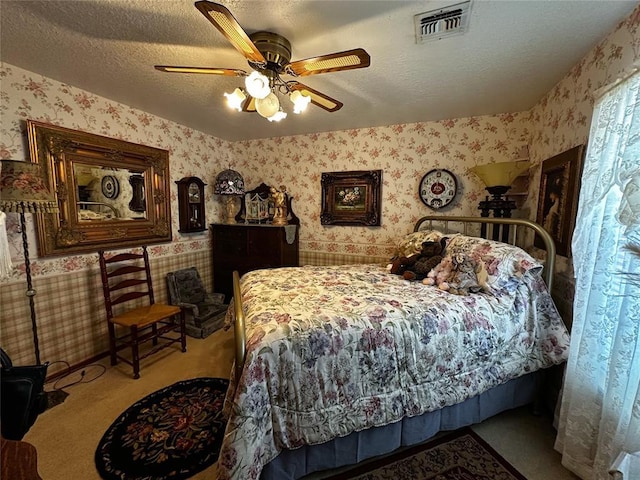 16296 N County Road 3264th Rd, Pauls Valley, OK 73075 - carpeted bedroom featuring a textured ceiling, wallpapered walls, and visible vents