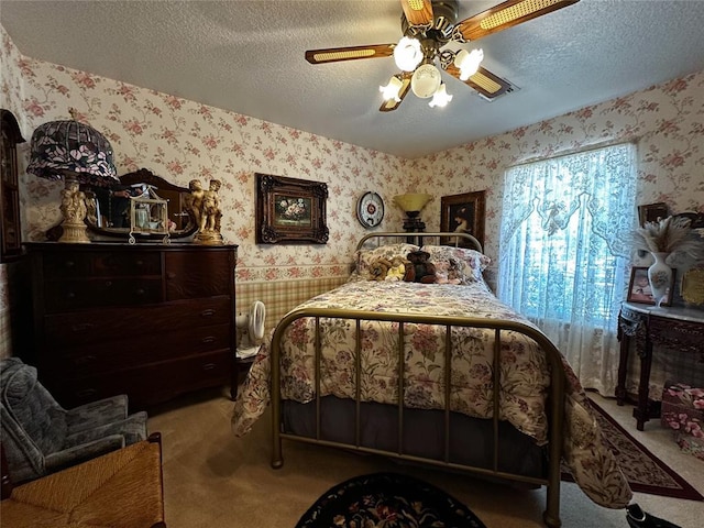 16296 N County Road 3264th Rd, Pauls Valley, OK 73075 - carpeted bedroom with a ceiling fan, a textured ceiling, and wallpapered walls