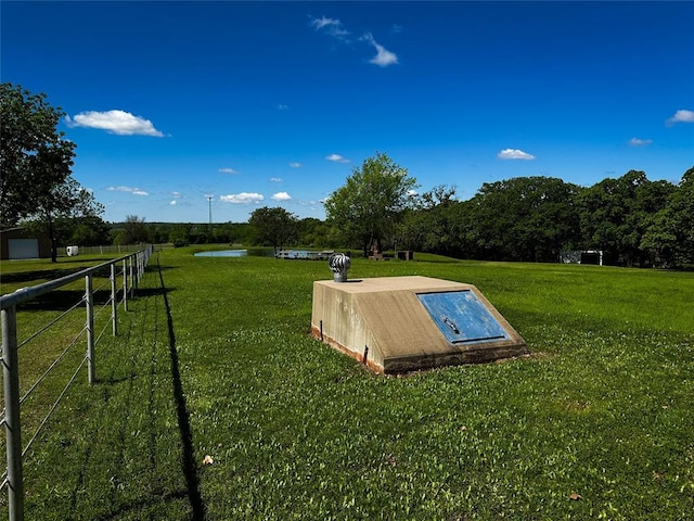 16296 N County Road 3264th Rd, Pauls Valley, OK 73075 - view of storm shelter with a water view and a yard