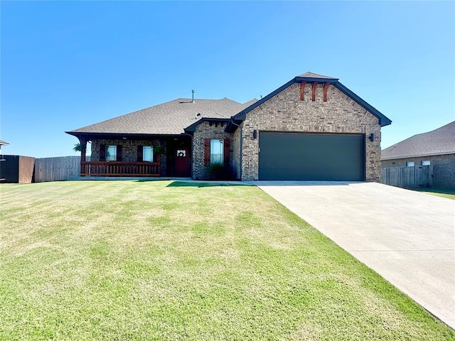 ranch-style home featuring an attached garage, a front lawn, fence, and brick siding