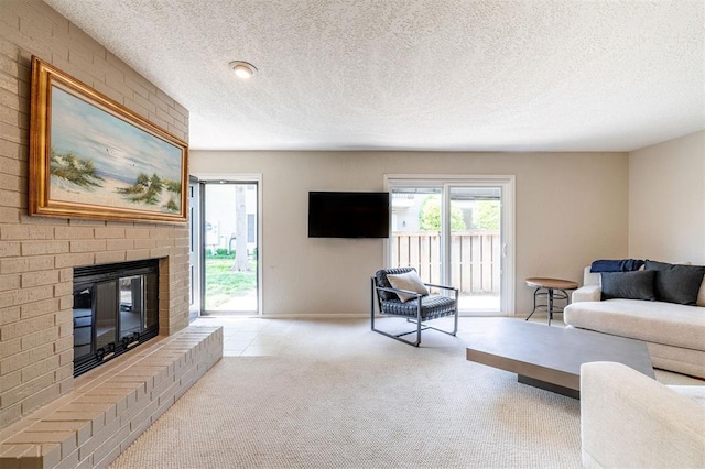 living room with baseboards, carpet flooring, a textured ceiling, and a brick fireplace